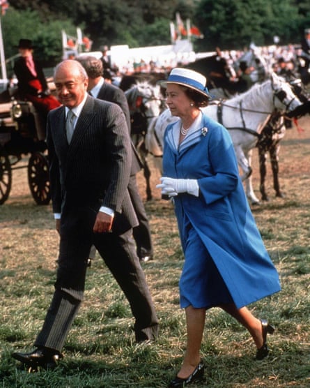 Mohamed Al Fayed and Queen Elizabeth II in 1988.