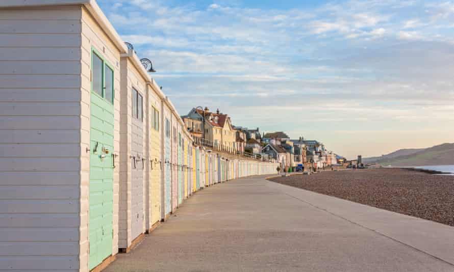 Beach huts line the promenade in Lyme Regis.
