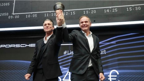 Porsche deputy chairman Lutz Meschke and chairman Oliver Blume ring the opening bell in Frankfurt