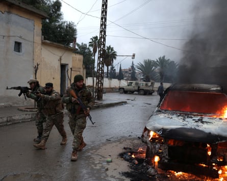 Syrian defence ministry forces entering the Raqqa on Sunday, when the government announced a ceasefire agreement with the Kurdish-led Syrian Democratic Forces