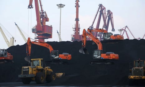 File photo of workers unloading coal at a port in Lianyungang, China