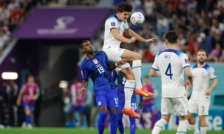Harry Maguire beats Haji Wright of the United States to a header in England’s 2022 World Cup Group B match.