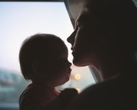 Image of a mother and baby by a window