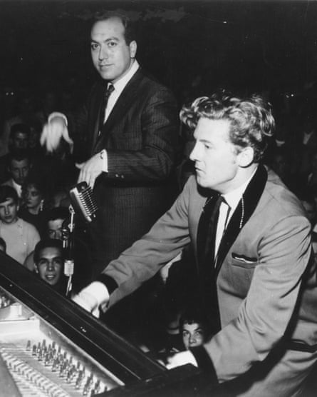 Art Laboe, standing, with Jerry Lee Lewis performing at one of his concerts, which drew huge multiracial audiences.