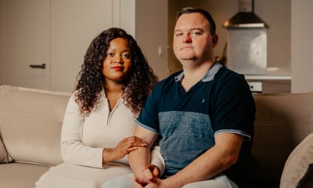 Portrait of Laura Jones and her husband Jack Jones, who are undergoing IVF amidst the cost of living crisis, pictured in the living room of their flat. Bournemouth, Dorset, United Kingdom.
