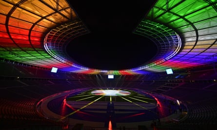 The Olympiastadion in Berlin, venue for the Euro 2024 final, lit up with the colours of the championship logo