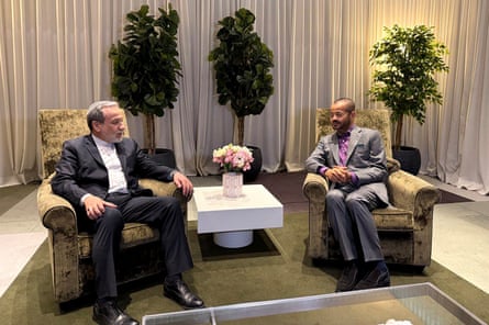 Abbas Araghchi and Badr bin Hamad Al Busaidi sitting next to each other in armchairs