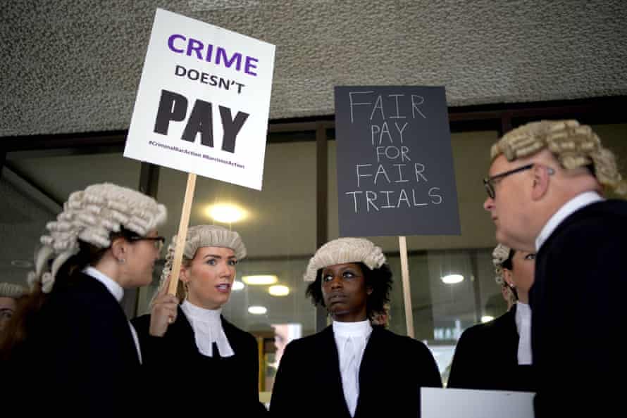 Criminal barristers strike actionCriminal barristers from the Criminal Bar Association (CBA), which represents barristers in England and Wales, outside Manchester Crown Court on the first of several days of court walkouts by CBA members in a row over legal aid funding. Picture date: Monday June 27, 2022. PA Photo. Barristers are expected to stage picket lines outside court, including at the Old Bailey in London and at crown courts in Birmingham, Bristol, Cardiff, Leeds and Manchester. The strike action is intended to last for four weeks, beginning with walkouts on Monday June 27 and Tuesday June 28, increasing by one day each week until a five-day strike from Monday July 18 to Friday July 22. See PA story LEGAL Barristers. Photo credit should read: Peter Byrne/PA Wire