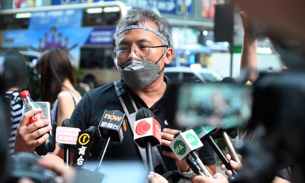 Ronson Chan, chairman of the Hong Kong Journalists Association (HKJA), talks to the media outside the Mongkok police station in Hong Kong before he was charged with obstructing police