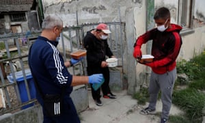 An activist delivers meals to deprived Roma people in Miskolc, Hungary