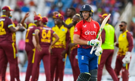 Jos Buttler of England walks off the field dismissed by Jason Holder of the West Indies.