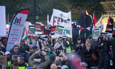 People begin to march at the pro-Palestinian protest in London, marching from Hyde Park to the US embassy in Vauxhall.