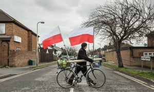A man with Poland flags in South Ruislip, London
