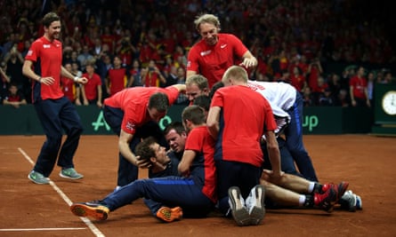 Andy Murray is mobbed by the rest of the Great Britain team after seeing off David Goffin.