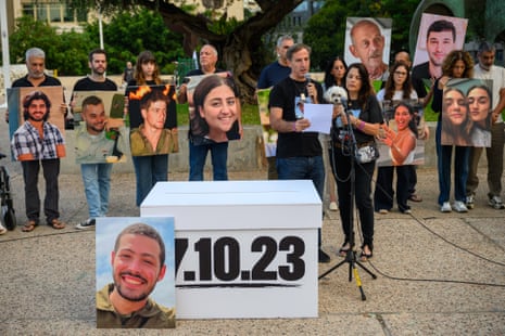 Ruby Chen and Hagit Chen, parents of Itay Chen, an IDF solider killed during the 7 October attacks, speaks at the event in Tel Aviv.
