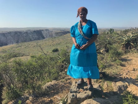Somkhele resident Thulziwe Jane Dladla, with the opencast coal mine in the background.