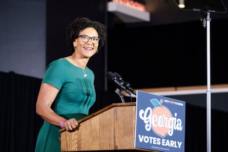 a woman speaks into a microphone