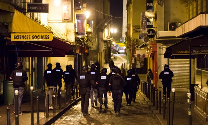 Armed police officers go on foot patrol around the Saint-German neighbourhood after the attacks on Paris