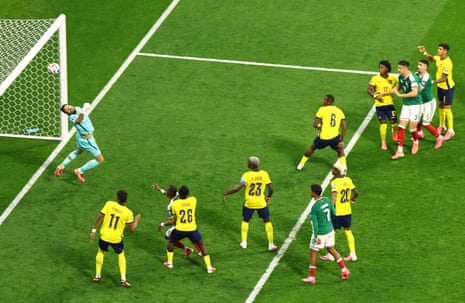 Ecuador's Hernan Galindez repels a header from Montes