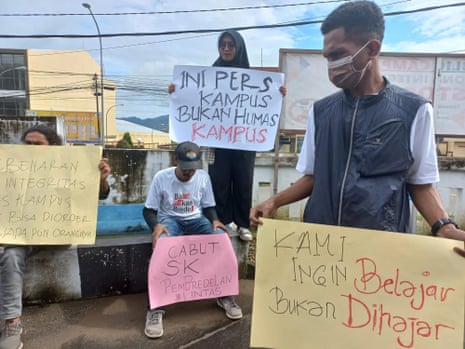 Students protest outside a court in Ambon, Indonesia, in support of the Lintas student magazine.