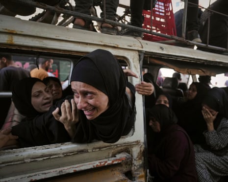 Palestinians mourn their relatives killed from an Israeli army bombardment of Gaza, at Shifa hospital in Gaza City on 22 July 2025.