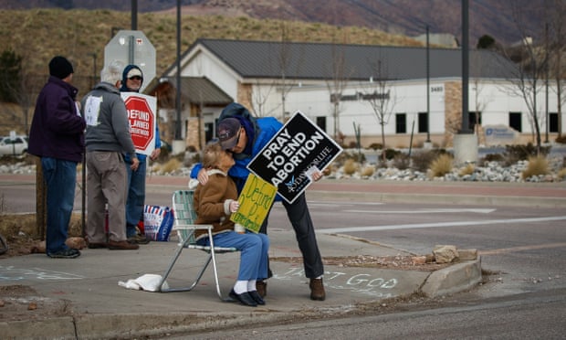 Anti-abortion protesters embrace during a demonstration in Colorado Springs, Colorado. 