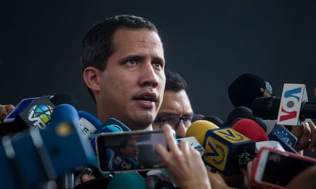 Juan Guaidó speaks with journalists before the start of a parliamentary session in an auditorium located in the El Hatillo sector, in eastern Caracas.
