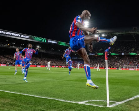 Jean-Philippe Mateta makes a leaping high-kick of celebration at the corner flag