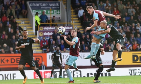 Chris Wood leaps to score Burnley’s late equaliser against West Ham, who played most of the game with ten men following the dismissal of Andy Carroll.
