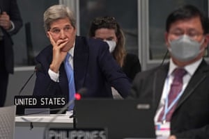John Kerry, the United States special presidential envoy for climate, left, attends a plenary session