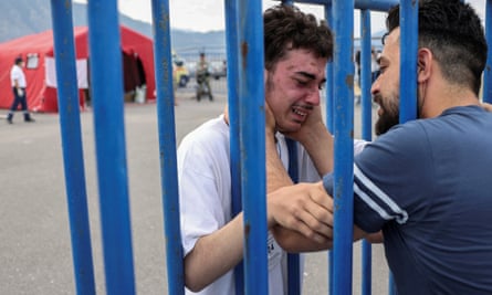 A Syrian survivor of the Adriana shipwreck, Fedi, 18, cries as he reunites with his brother Mohammad, in Kalamata, Greece, on 16 June 2023.