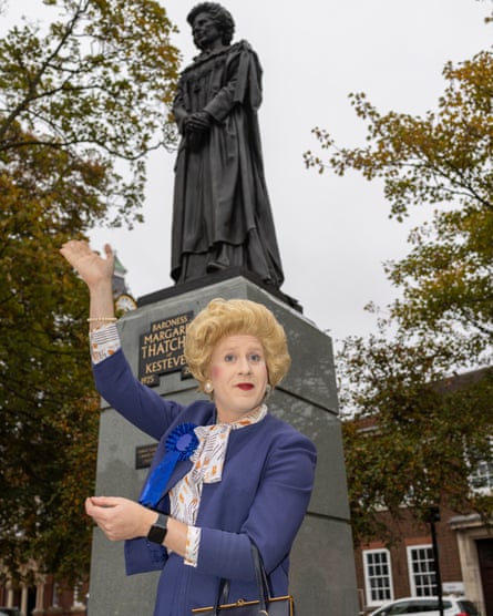 Matt Tedford in Margaret Thatcher costume, standing by her statue