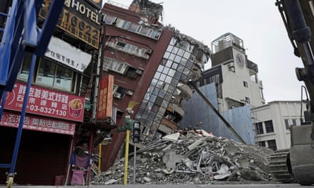 Demolition work under way at a quake-damaged building in Hualien, Taiwan
