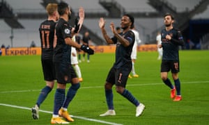 Raheem Sterling celebrates after he scored Manchester City’s third goal against Marseille.