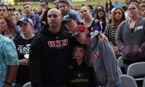 People hold a vigil for the victims of the Las Vegas shooting at the Ascend Amphitheater in Nashville