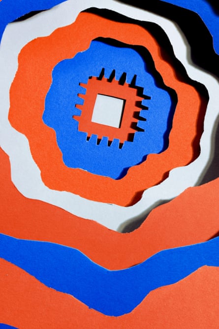 Red, white and blue layered paper cutout of a microchip