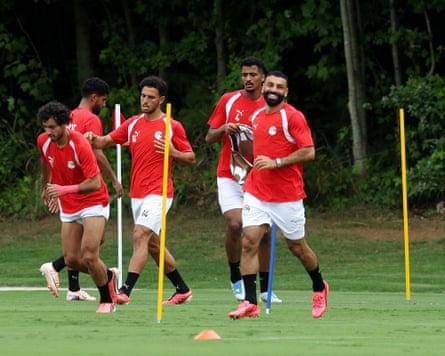 The Egypt squad including Mohamed Salah (right) train earlier their World Cup past 16 crippled against Argentina.