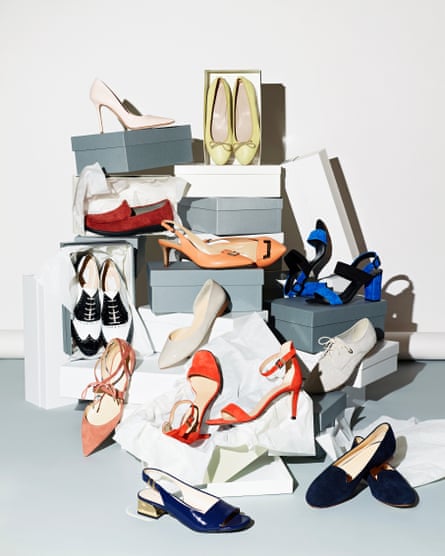 Various pair of shoes with boxes against white background