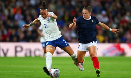 Scotland’s Kirsty Hanson and England’s Lucy Bronze compete for the ball. 