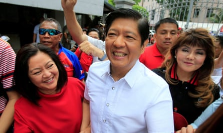 Ferdinand ‘Bongbong’ Marcos with his wife, Louise (L) and his sister Imee (R).