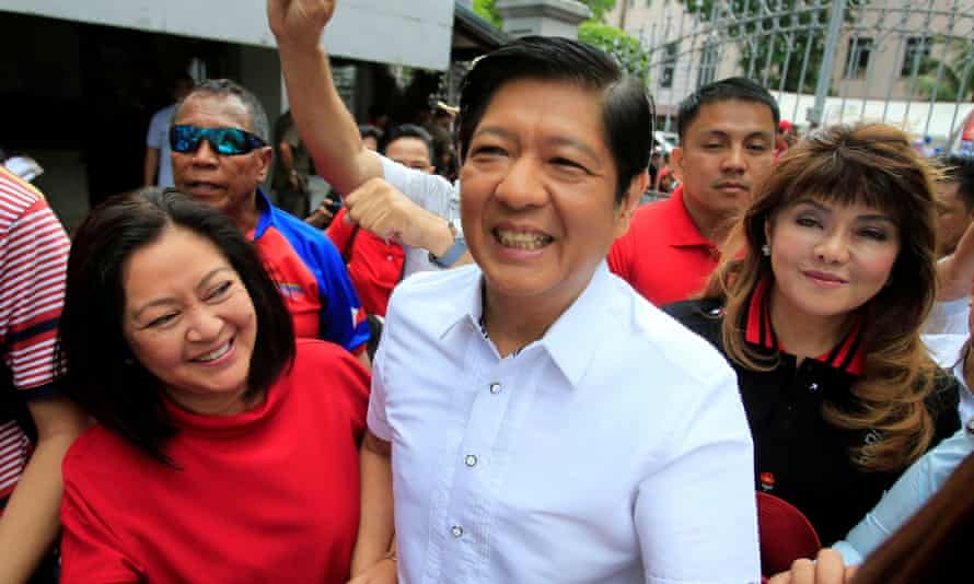 Ferdinand ‘Bongbong’ Marcos with his wife, Louise (L) and his sister Imee (R).
