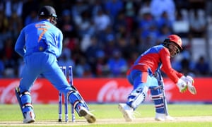 Rashid Khan of Afghanistan looks back as he is stumped by MS Dhoni of India.