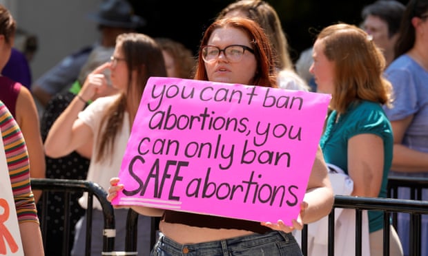 An abortion rights supporter holds a sign outside the South Carolina state house on 7 July