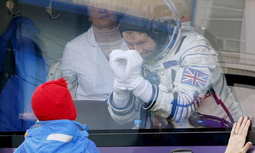 Peake says goodbye to his children from a bus before boarding the Soyuz rocket.