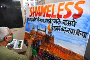 A schoolteacher in Mumbai, India, paints a depiction of Delhi's Red Fort