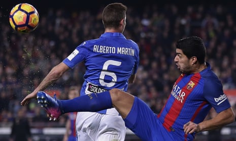Barcelona’s Luis Suárez duels for the ball with Leganes’ Alberto Martin.