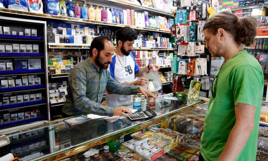 An Iranian man shopping for food in Tehran