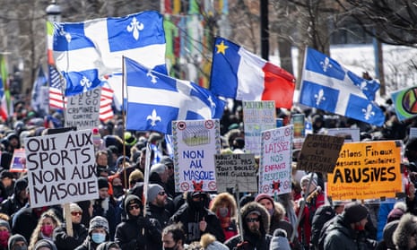 People take part in a demonstration to oppose government restrictions to curb the spread of Covid-19 in Montreal on Saturday.