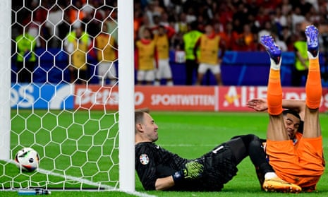 Netherlands' Cody Gakpo and Turkey's goalkeeper Mert Gunok after Mert Müldür puts the ball into this own net.