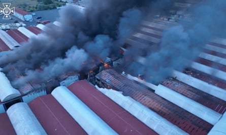 Smoke billows from a fire at a site of storage facilities hit during the strikes in Odesa